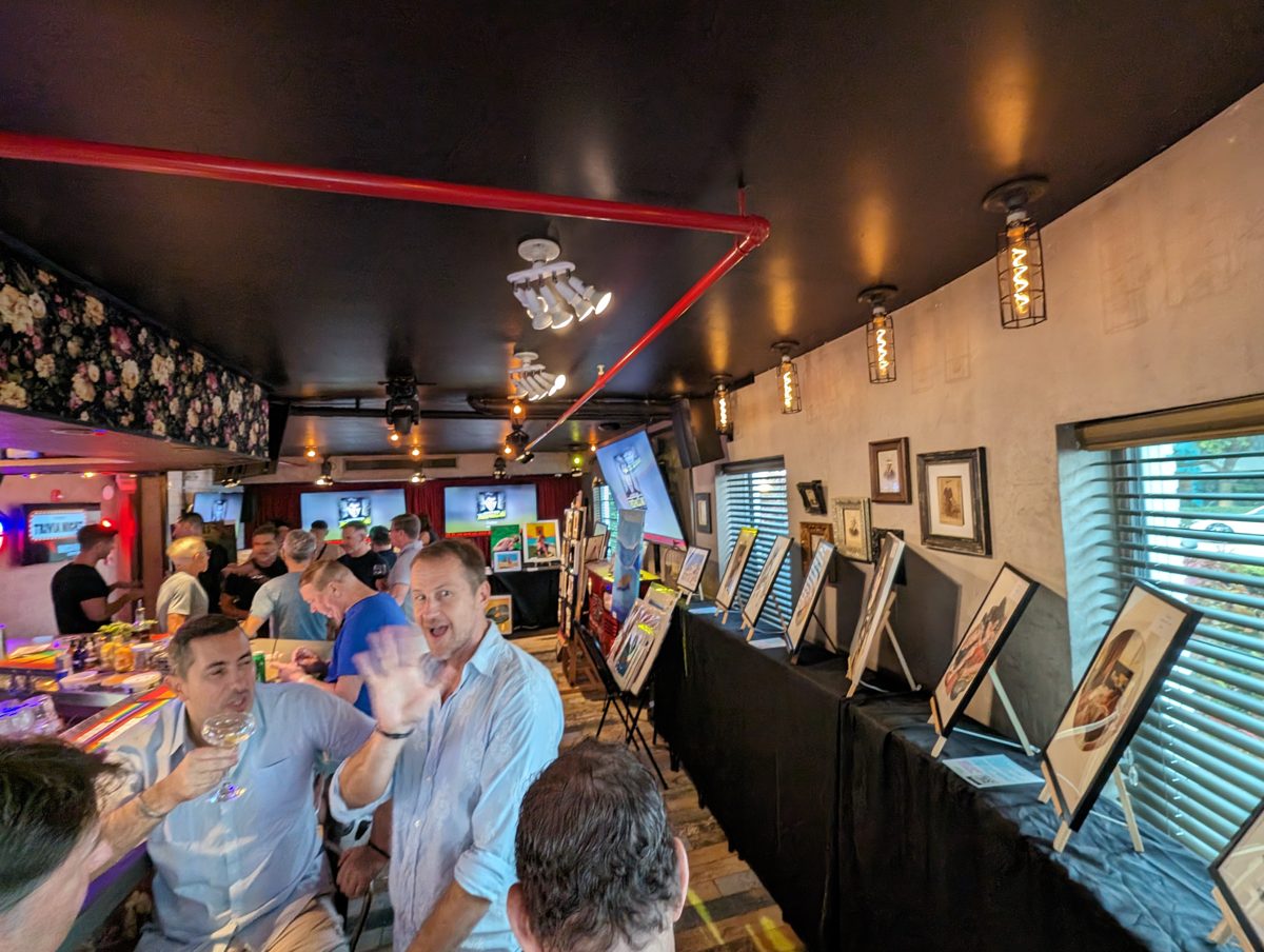 Guests and artwork at a Queer Easels showcase night